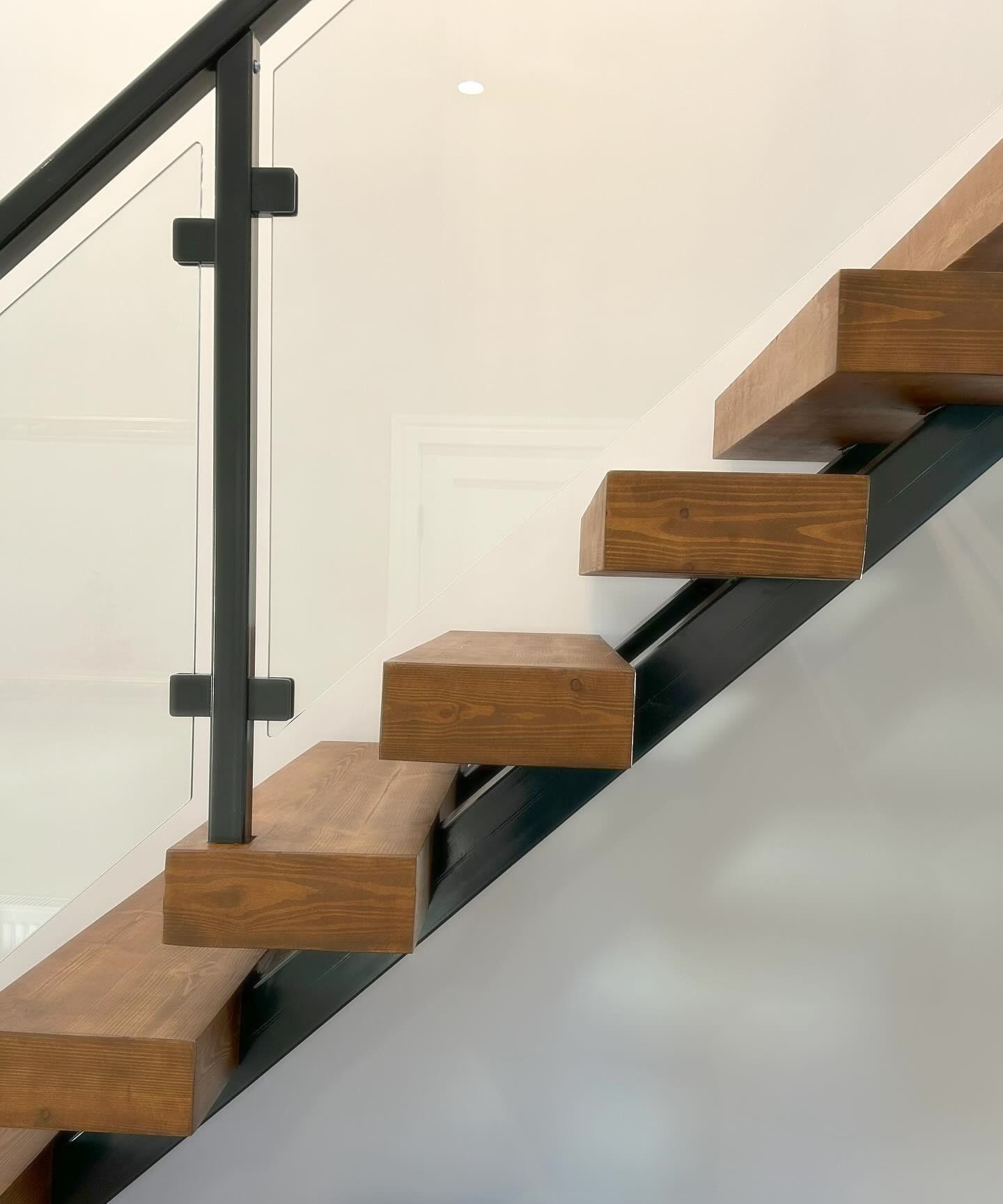 Steel timber glass staircase closeup - Blake Group.jpg